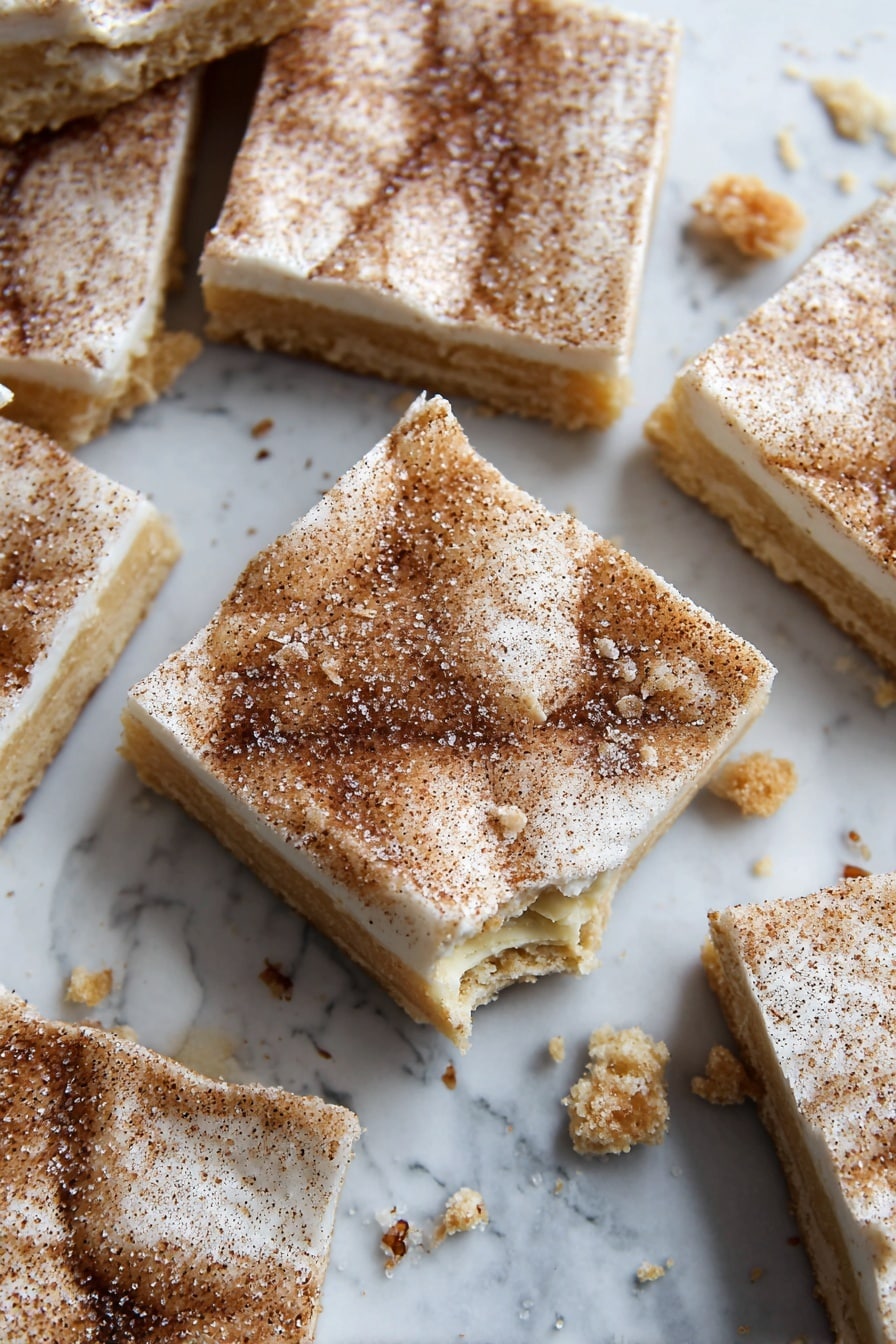 The image shows several square pieces of a dessert with two visible layers. The bottom layer is a light golden brown color, appearing firm and slightly crumbly with some broken pieces around. The top layer is white and smooth, coated evenly with a dusting of fine brown cinnamon and sugar crystals giving a sparkly texture. One piece in the center has a small bite taken out, revealing the two layers clearly. All the squares are arranged randomly on a white marbled surface with scattered crumbs nearby. photo taken with an iphone --ar 2:3 --v 7 - Churro Saltine Toffee, Saltine Toffee Recipe, Easy Toffee Snacks, Salty Sweet Toffee, Crowd-Pleasing Toffee Treats