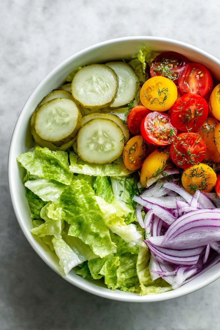 A white bowl filled with fresh salad shows four distinct layers: the bottom layer is bright green chopped romaine lettuce with a crisp texture, on the left side there are five slices of light green pickles with ridged edges, on the top right are halved red and yellow cherry tomatoes sprinkled with small green dill leaves, and on the bottom right are thin rings of purple onion with a smooth texture. The bowl sits on a white marbled textured surface photo taken with an iphone --ar 2:3 --v 7 - Healthy Burger Bowls with Special Sauce, healthy burger bowl recipe, quick healthy dinner, low-carb burger bowl, flavorful burger bowl with sauce