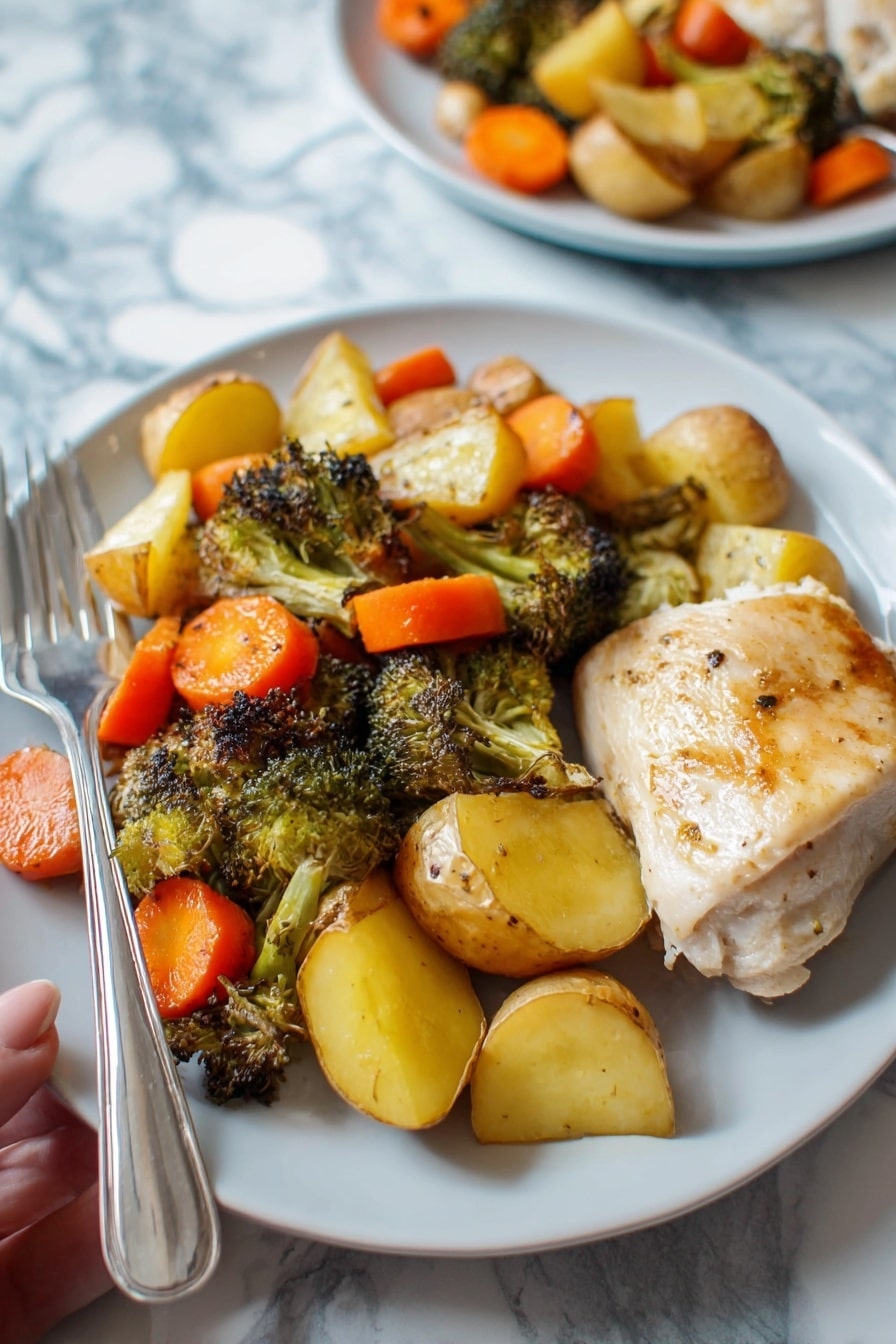 The dish shows a white plate with a piece of cooked light golden chicken on the right side. On the left side, there is a colorful mix of roasted vegetables with three visible layers: bright orange carrot slices, golden yellow roasted potatoes cut into quarters, and dark green roasted broccoli florets with some charred edges, all mixed together. A shiny silver fork with a woman’s hand holding it rests on the left side of the plate. The plate sits on a white marbled surface with another similar plate blurred in the background. photo taken with an iphone --ar 2:3 --v 7 - Honey Garlic Chicken and Vegetables, sheet pan chicken recipe, easy healthy dinner, one-pan chicken and veggies, quick weeknight meal