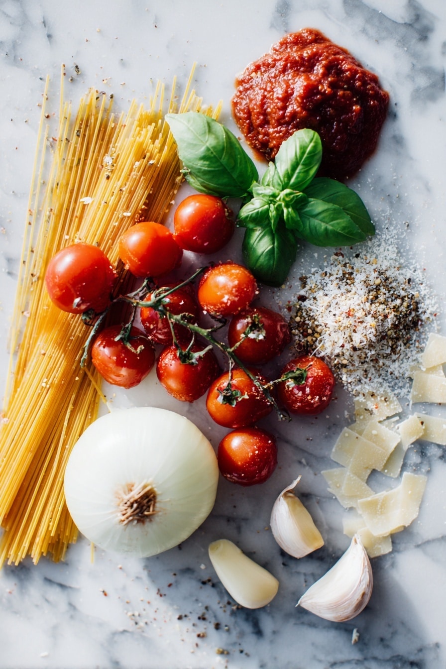 Sheet Pan Spaghetti Recipe 6 Flat lay of vibrant cherry tomatoes bursting with color, a large sliced onion with translucent layers, whole peeled garlic cloves, fresh bright green basil leaves, dried Italian seasoning and oregano sprinkled artfully, a small pile of uncooked golden spaghetti strands, rich red tomato paste dolloped smoothly, and delicate shavings of Parmesan cheese scattered lightly, placed on a white marble surface, photo taken with an iphone --ar 2:3 --v 7 - Sheet Pan Spaghetti, easy sheet pan pasta, one-pan spaghetti dinner, roasted vegetable pasta, quick weeknight pasta